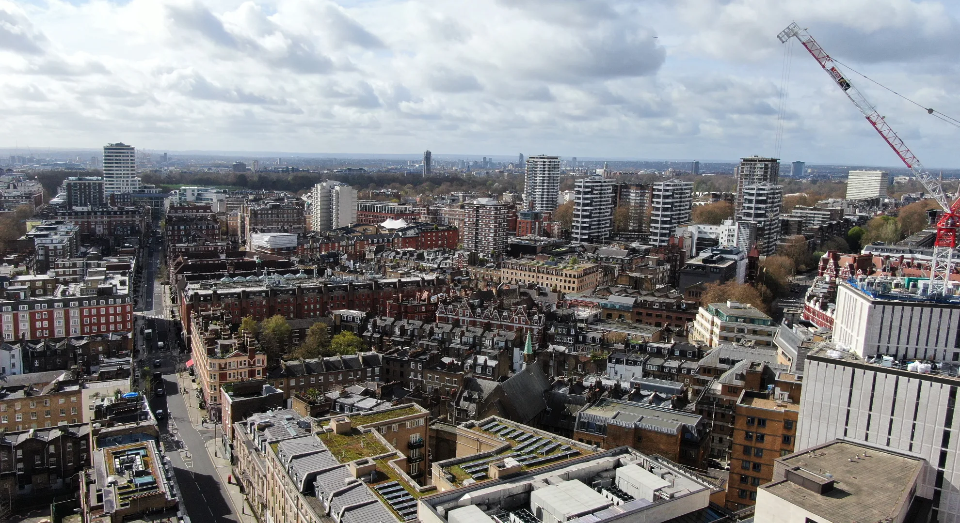 Aerial drone photography of urban commercial and residential real estate for property marketing and sales.
