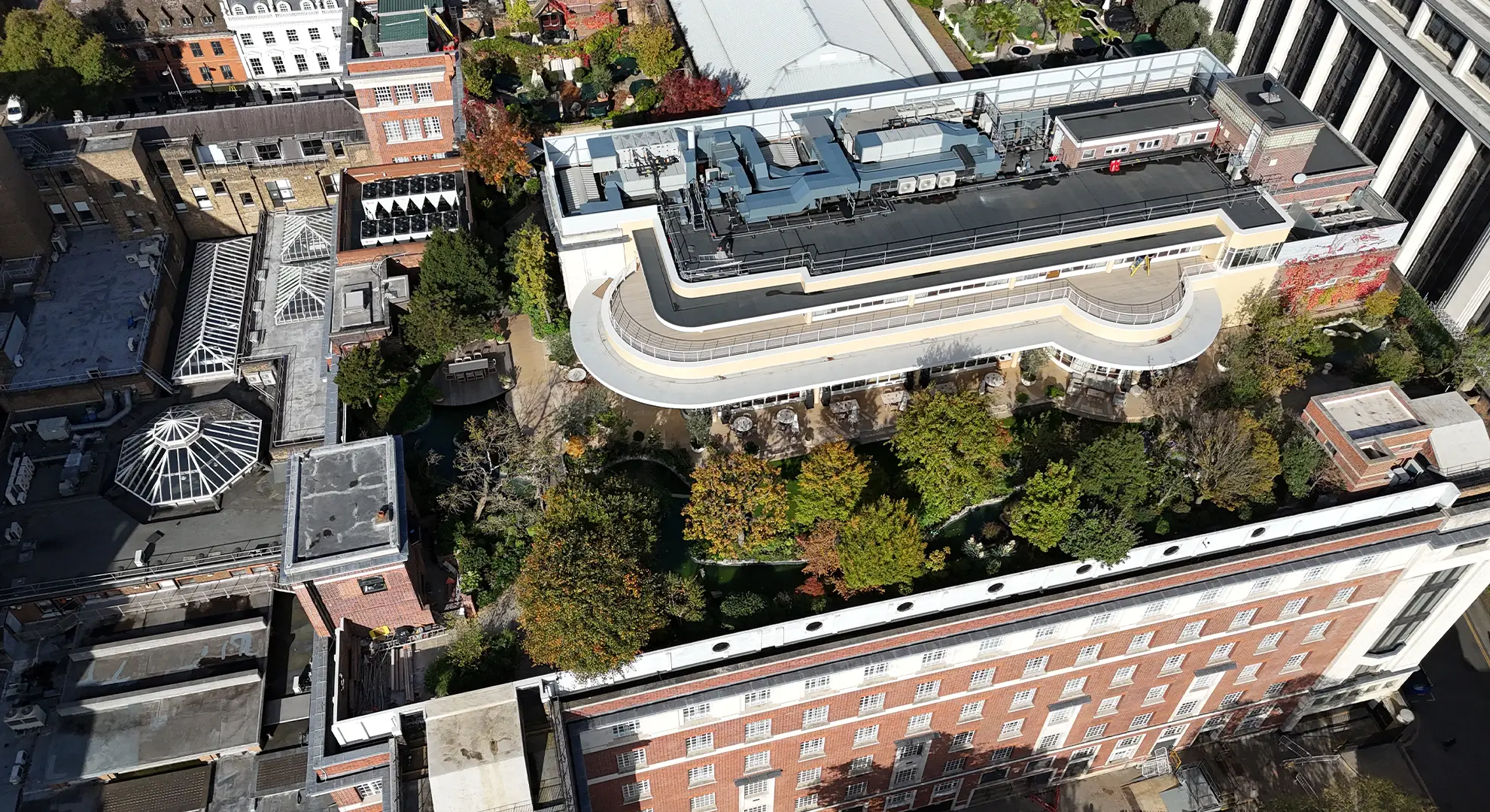 Aerial drone photo mapping survey of a commercial building rooftop showing HVAC infrastructure and roof garden layout.