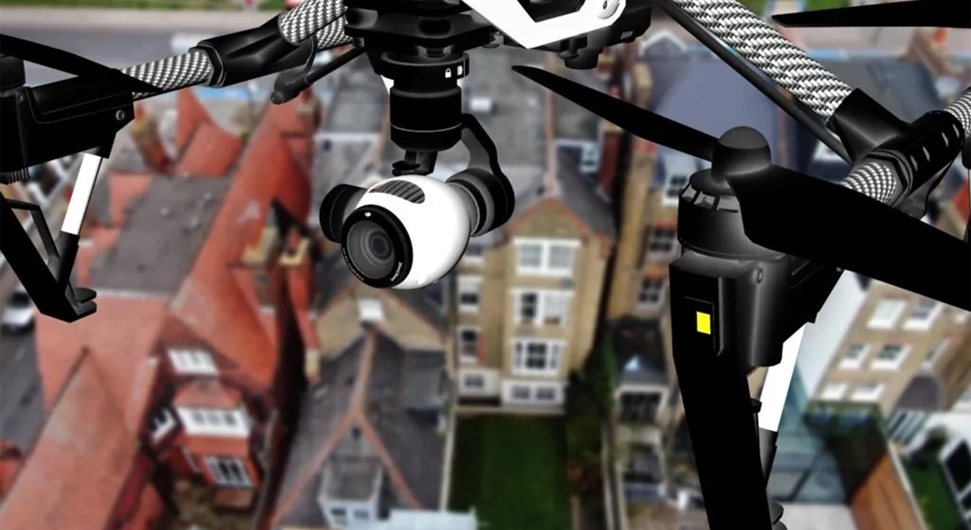 Close-up of a drone's camera and gimbal system flying above a residential neighborhood